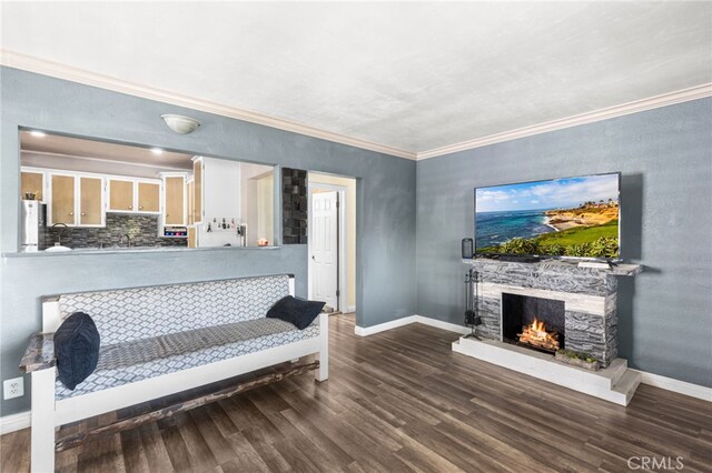 10521 Asher St, El Monte, CA 91733 - living area with wood finished floors, a lit fireplace, ornamental molding, and baseboards