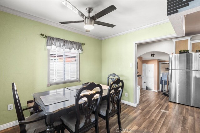 10521 Asher St, El Monte, CA 91733 - dining room with a ceiling fan, arched walkways, wood finished floors, baseboards, and ornamental molding