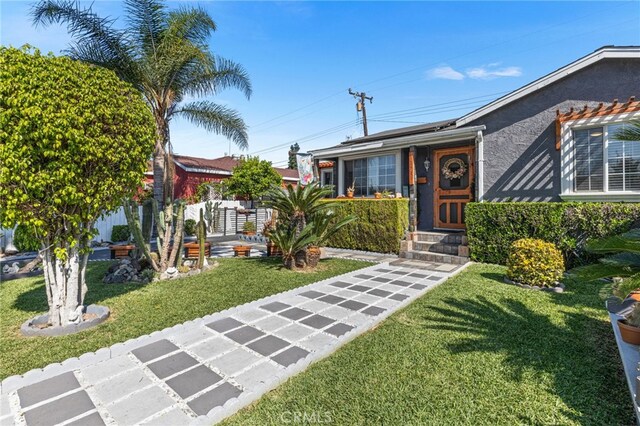 10521 Asher St, El Monte, CA 91733 - ranch-style home with a front lawn, solar panels, and stucco siding