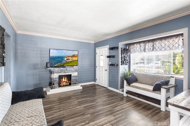10521 Asher St, El Monte, CA 91733 - living area with wood finished floors, a warm lit fireplace, baseboards, and crown molding