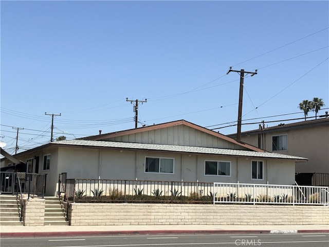 7731 Slater Ave, Huntington Beach, CA 92647 - view of front of home featuring fence
