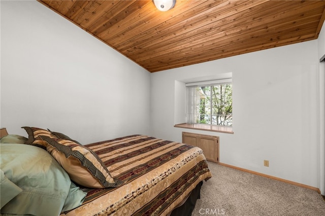 bedroom with wooden ceiling, light carpet, baseboards, and lofted ceiling