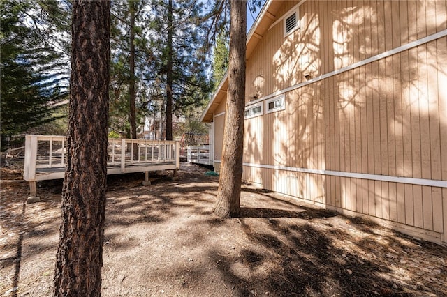 view of side of property with a deck
