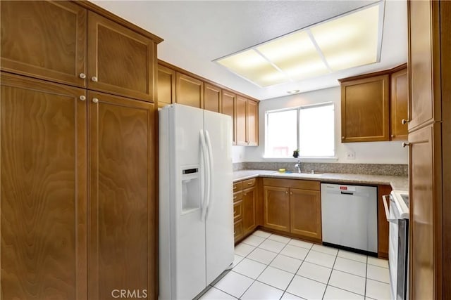 2384 Via Mariposa W Unit 3G, Laguna Woods, CA 92637 - kitchen with white fridge with ice dispenser, dishwashing machine, range, brown cabinetry, and a sink