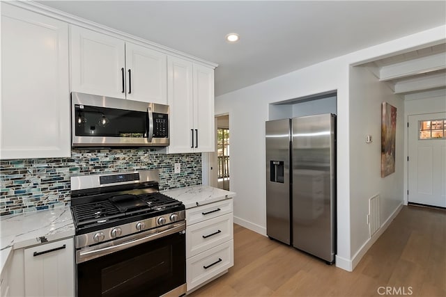 27757 N Bay Rd, Lake Arrowhead, CA 92352 - kitchen with appliances with stainless steel finishes, light wood-type flooring, tasteful backsplash, light stone countertops, and recessed lighting