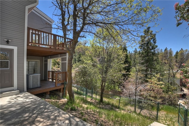 27757 N Bay Rd, Lake Arrowhead, CA 92352 - view of yard featuring fence, central air condition unit, and a wooden deck