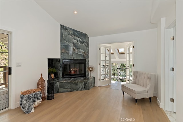 27757 N Bay Rd, Lake Arrowhead, CA 92352 - living room with wood finished floors, a tile fireplace, baseboards, and recessed lighting