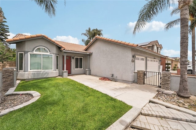 2925 Greenbriar Dr, Ontario, CA 91761 - view of front of home with a garage, stucco siding, a tile roof, and driveway