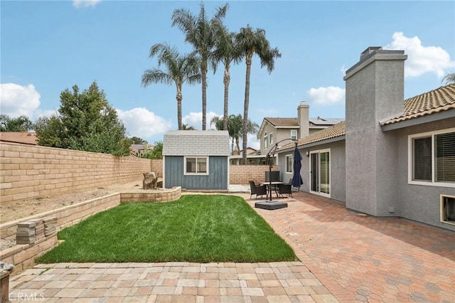 2925 Greenbriar Dr, Ontario, CA 91761 - view of yard featuring a patio area and an outbuilding