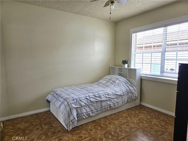 2149 Clover St, Simi Valley, CA 93065 - bedroom with a textured ceiling, baseboards, and ceiling fan