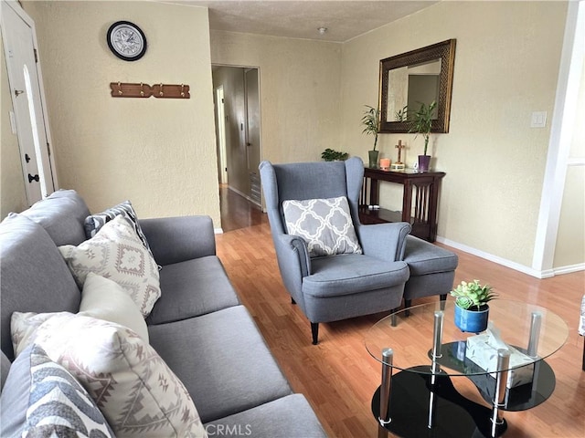 2149 Clover St, Simi Valley, CA 93065 - living room with wood finished floors, baseboards, and a textured wall