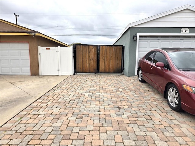 2149 Clover St, Simi Valley, CA 93065 - garage featuring a gate, driveway, and fence