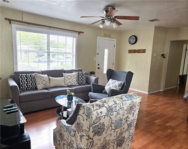 2149 Clover St, Simi Valley, CA 93065 - living room with wood finished floors, a ceiling fan, a textured wall, and baseboards