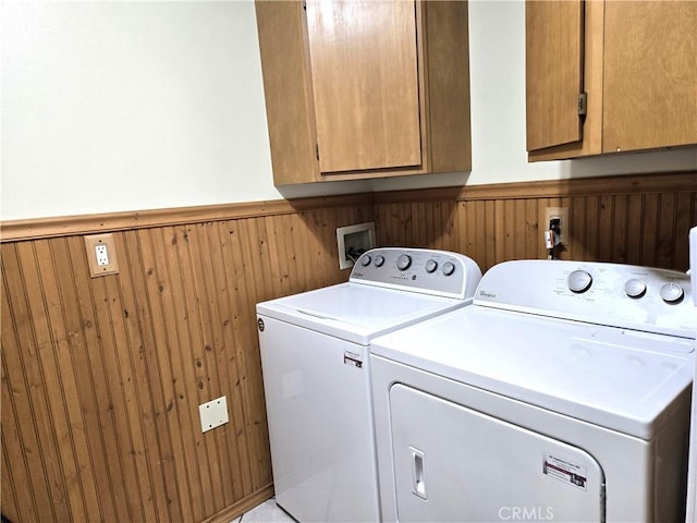 2149 Clover St, Simi Valley, CA 93065 - washroom featuring cabinet space, a wainscoted wall, separate washer and dryer, and wooden walls