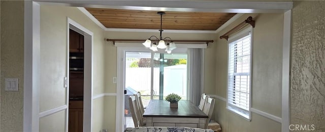 2149 Clover St, Simi Valley, CA 93065 - dining space featuring a chandelier, crown molding, healthy amount of natural light, and wooden ceiling