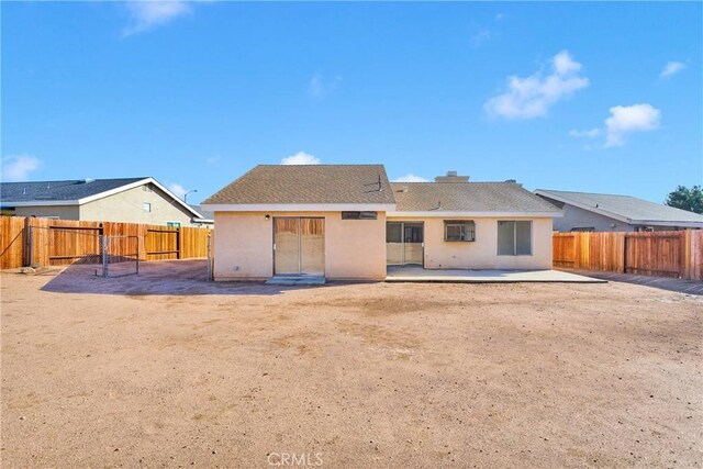14359 Birchwood Dr, Hesperia, CA 92344 - back of property with stucco siding, a patio area, and a fenced backyard