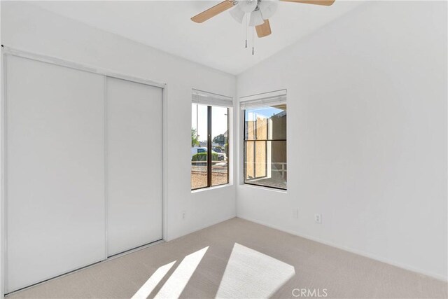 14359 Birchwood Dr, Hesperia, CA 92344 - unfurnished bedroom with carpet, vaulted ceiling, a closet, and a ceiling fan