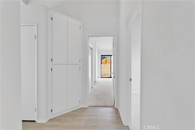 14359 Birchwood Dr, Hesperia, CA 92344 - corridor featuring light wood-style flooring and baseboards