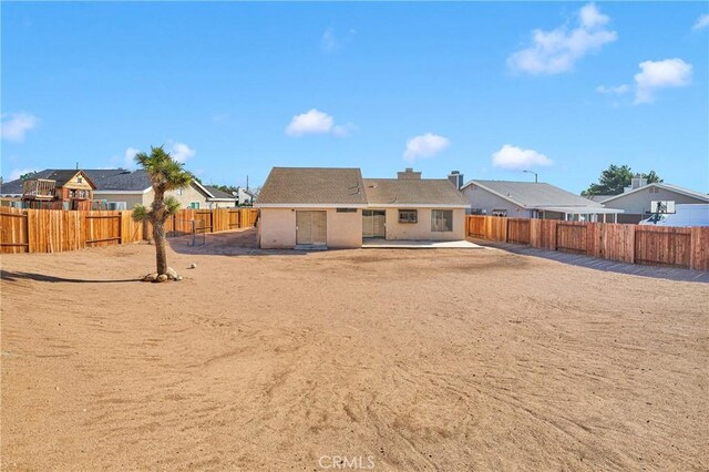 14359 Birchwood Dr, Hesperia, CA 92344 - back of house with a residential view, a fenced backyard, and a patio