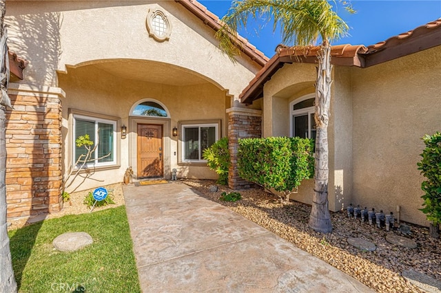 doorway to property with stucco siding
