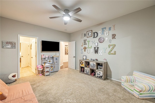 rec room featuring carpet, a ceiling fan, and baseboards