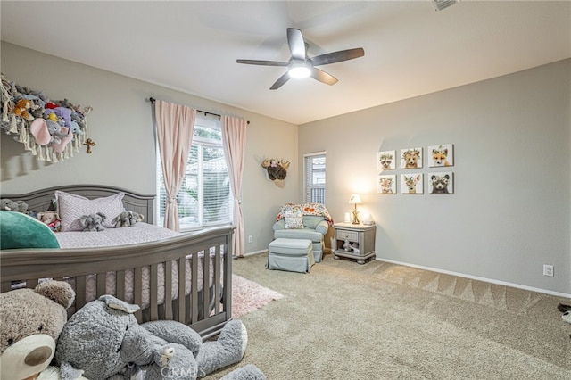 bedroom with carpet flooring, a ceiling fan, and baseboards