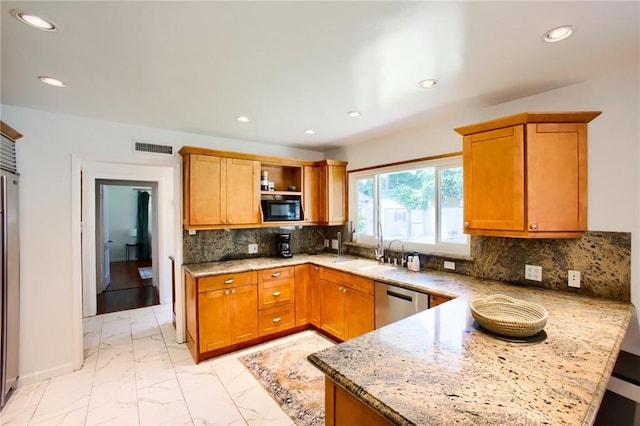 18041 Acre St, Northridge, CA 91325 - kitchen with stainless steel appliances, light marble finish floors, a peninsula, recessed lighting, and light stone countertops