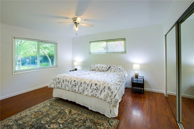 18041 Acre St, Northridge, CA 91325 - bedroom featuring multiple windows, baseboards, dark wood finished floors, and ceiling fan