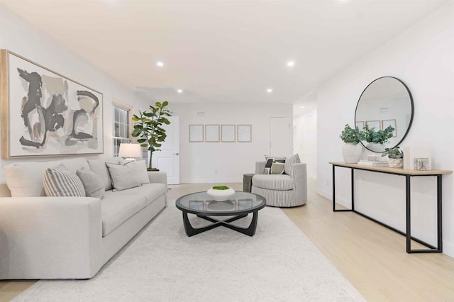 living room with recessed lighting, wood finished floors, and baseboards