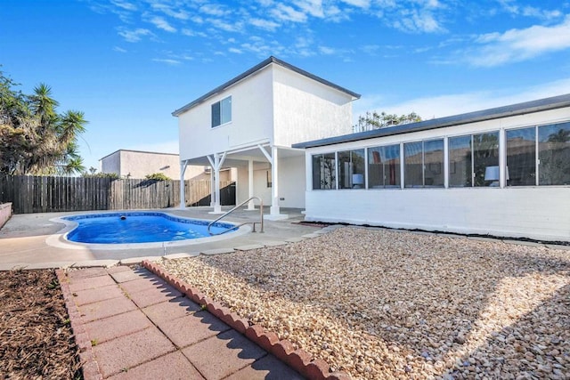 view of pool featuring a patio and a fenced backyard