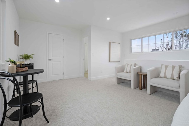 living area with recessed lighting, carpet floors, and baseboards