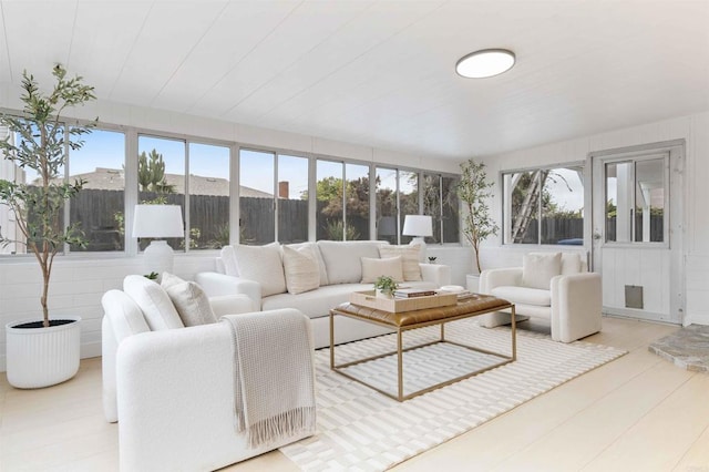 sunroom featuring wood finished floors
