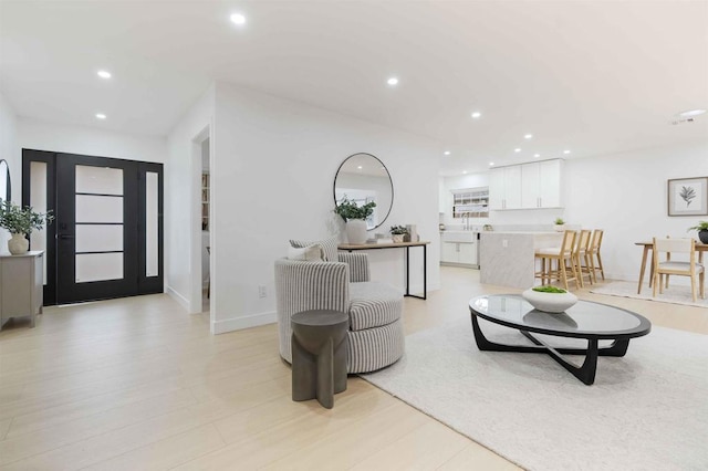 living area with recessed lighting and baseboards