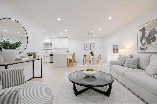 living room featuring recessed lighting and light wood finished floors