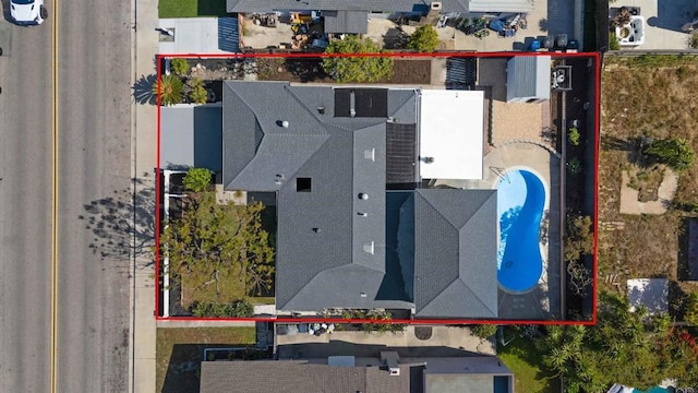 aerial overview of property's location featuring property parcel outlined and a pool