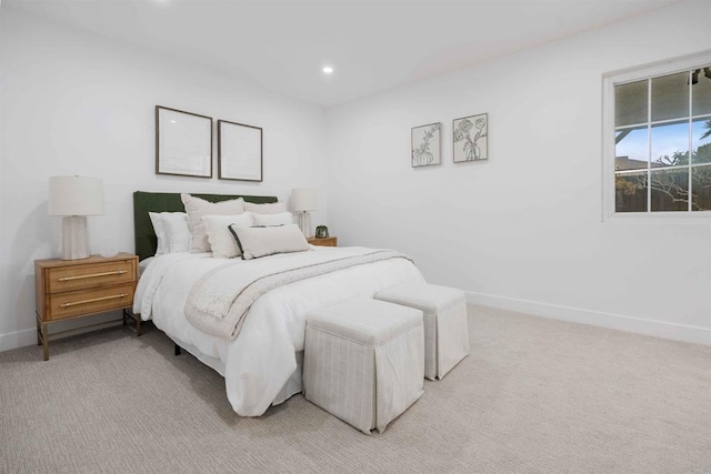 bedroom with baseboards, light colored carpet, and recessed lighting