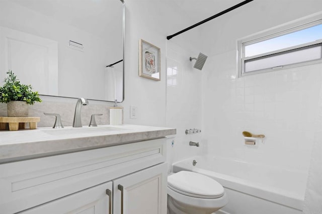 full bathroom with washtub / shower combination, toilet, and vanity