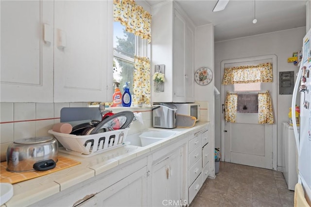 1801 N Ross St, Santa Ana, CA 92706 - kitchen with tile countertops and white cabinetry