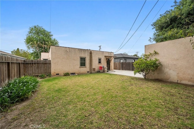 1801 N Ross St, Santa Ana, CA 92706 - back of house with stucco siding, a patio, and crawl space