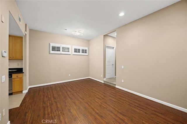 53 N Oak Ave Unit 5, Pasadena, CA 91107 - unfurnished living room featuring wood finished floors, baseboards, and recessed lighting