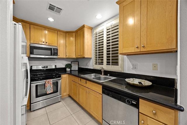 53 N Oak Ave Unit 5, Pasadena, CA 91107 - kitchen featuring stainless steel appliances, light tile patterned floors, dark countertops, and recessed lighting