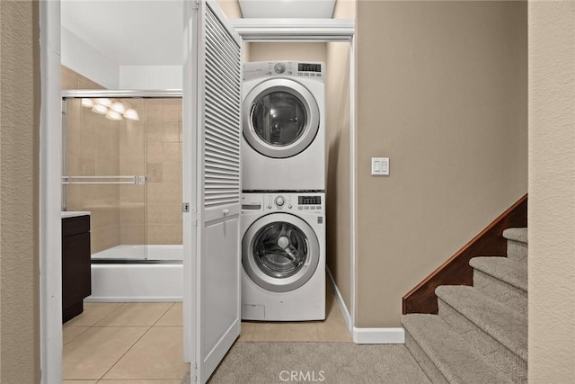 53 N Oak Ave Unit 5, Pasadena, CA 91107 - laundry room featuring stacked washer / dryer and tile patterned floors