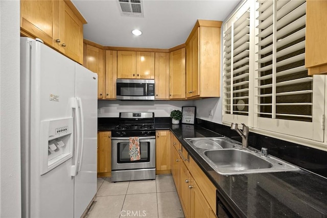 53 N Oak Ave Unit 5, Pasadena, CA 91107 - kitchen with stainless steel appliances, light tile patterned floors, a sink, and recessed lighting