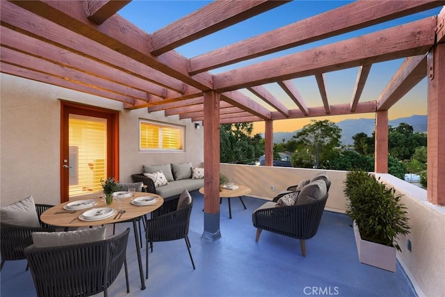 53 N Oak Ave Unit 5, Pasadena, CA 91107 - patio terrace at dusk with an outdoor hangout area, a pergola, and a mountain view