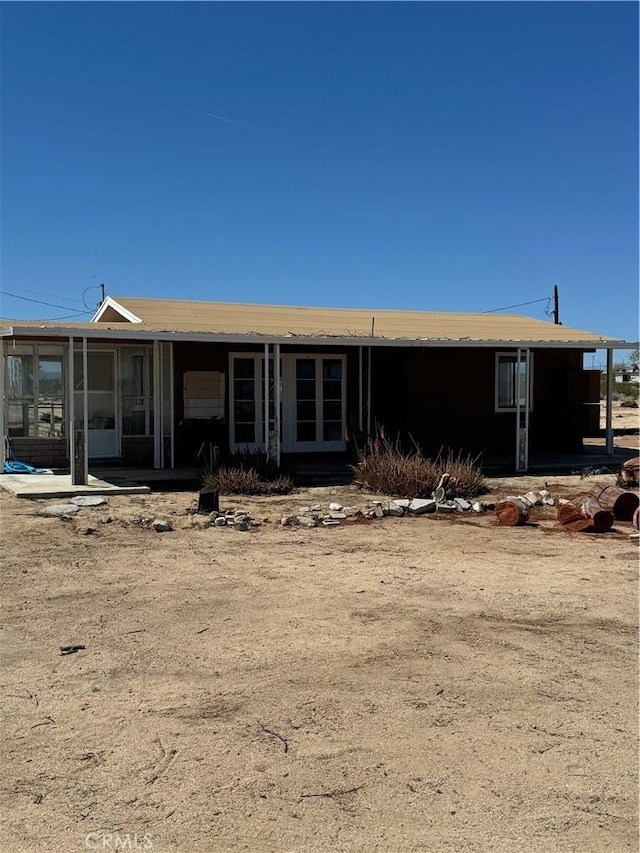 back of house featuring a sunroom