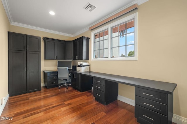 office featuring ornamental molding, dark wood finished floors, baseboards, built in desk, and recessed lighting