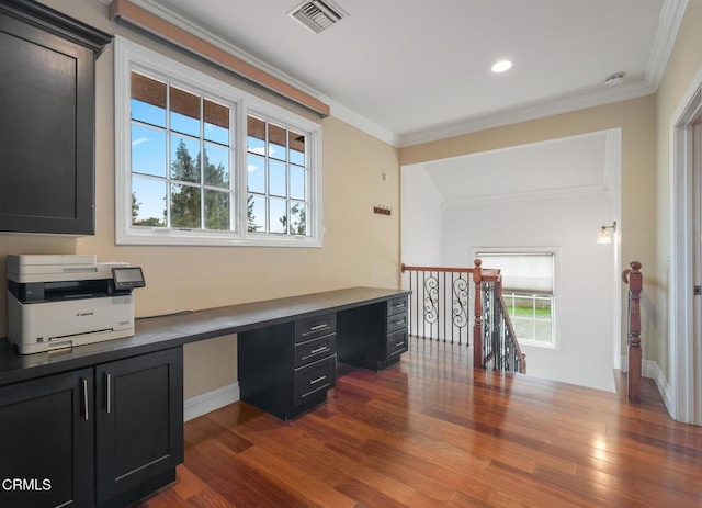 unfurnished office featuring ornamental molding, built in desk, dark wood-style flooring, baseboards, and recessed lighting
