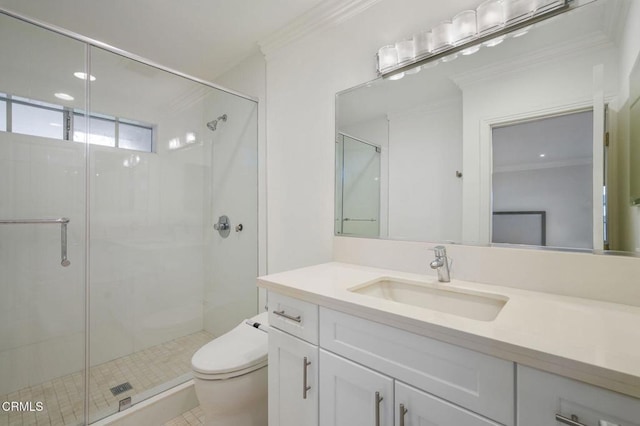 full bathroom featuring toilet, crown molding, a stall shower, and vanity