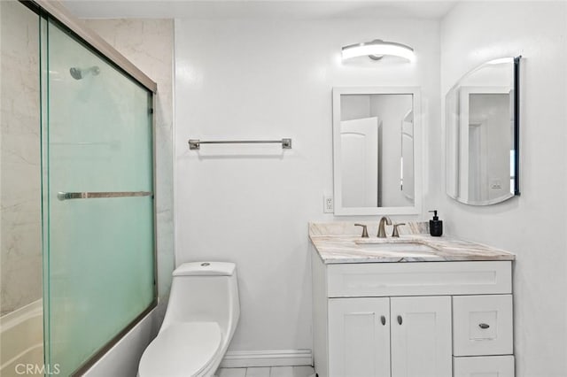 2613 Millbrae Ave, Duarte, CA 91010 - full bath with toilet, vanity, combined bath / shower with glass door, and baseboards