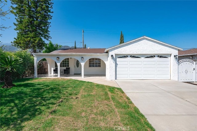 2613 Millbrae Ave, Duarte, CA 91010 - ranch-style house with an attached garage, concrete driveway, a front yard, a gate, and stucco siding